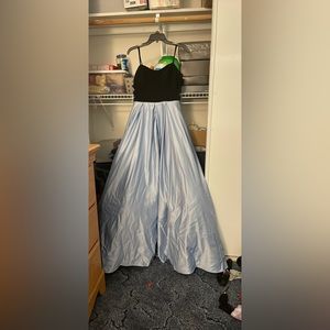 I am selling two long formal dresses one is white, the other is blue and black